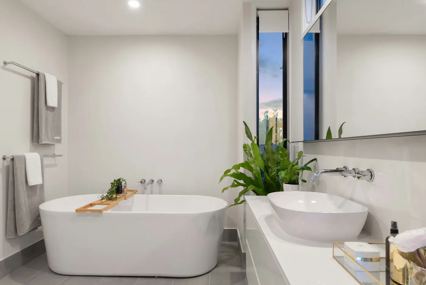 Bright, clean bathroom with a white bathtub